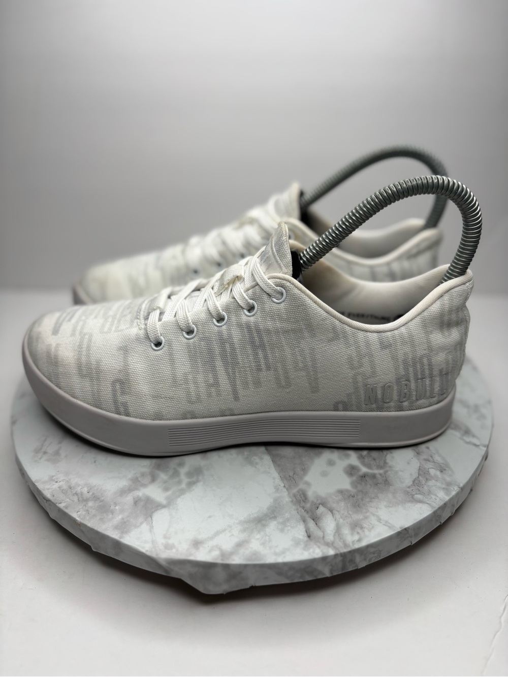 Size 7- NOBULL white trainers featuring a subtle grey camouflage pattern